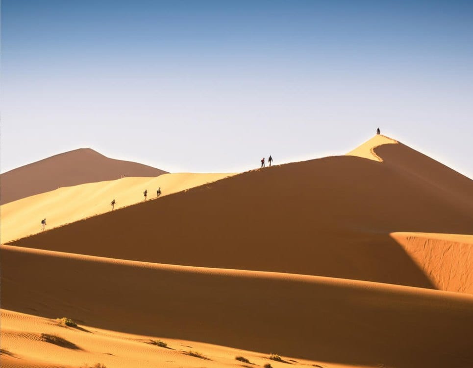Namibia: Climbing the dunes of Namibia.