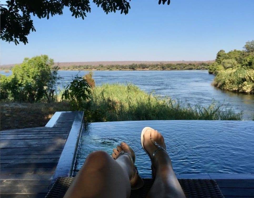 Zambia: Feet up, over the river.